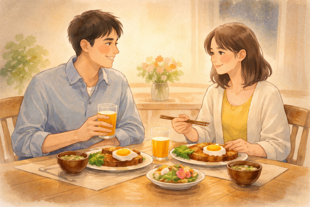 家の食卓で好物を囲み、向き合って笑い合う夫婦。派手さより温かさが残る誕生日の夜。